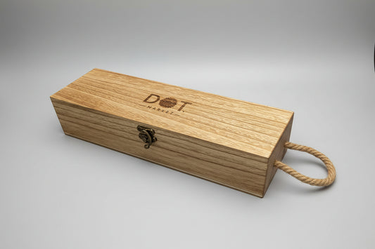 Wooden box with 'DOT' branding on a wooden surface